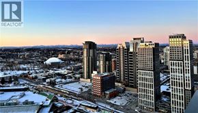 For rent in Calgary - A cityscape with a realtor logo in the corner.