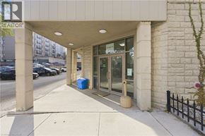 Hamilton apartment for rent - A building with a blue barrel in front of it.