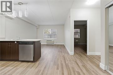 Hamilton apartment for rent - A kitchen with a dishwasher and a refrigerator.