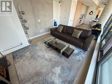 Toronto (Church-Yonge Corridor) condo for rent - A living room with a grey couch and a table.