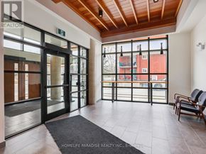 Waterloo condo for rent - A bathroom with a sink, mirror, and toilet.