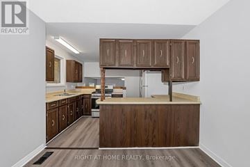 Ottawa other for rent - A kitchen with wooden cabinets and a countertop.