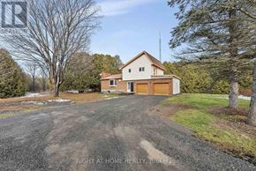 For rent in Ottawa - A house with a gravel driveway in front of it.
