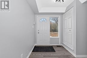 For rent in Ottawa - A hallway with a door and a window.