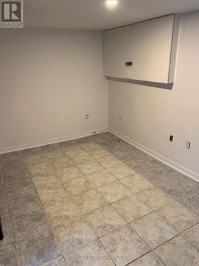 Casselman house for rent - A room with a tile floor and a mirror on the wall.