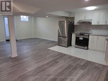 Brampton (Northwest Brampton) other for rent - A kitchen with a refrigerator and stove top oven.