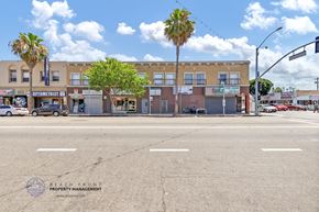 Wilmington apartment for rent - an empty street in front of a building with palm trees