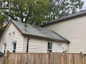 St. Catharines (Downtown) house for rent - A house with a fence in front of it.