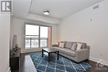 Ottawa condo for rent - A living room with a grey couch and a black coffee table.