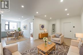 St. Thomas multi-family for rent - A well-lit, spacious living room with a dining area in the background.