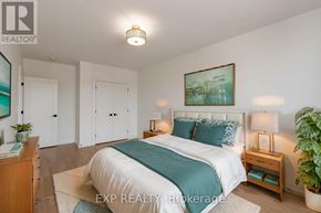 St. Thomas multi-family for rent - A bedroom with a bed, nightstands, and a plant.