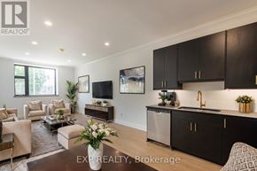 St. Thomas multi-family for rent - A modern kitchen with dark brown cabinets and a central island.