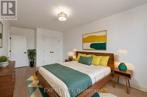 St. Thomas multi-family for rent - A bedroom with a bed, nightstand, and lamp.