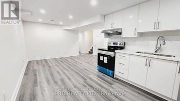 Mississauga (Fairview) house for rent - A kitchen with white cabinets and a blue dishwasher.