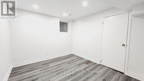 Mississauga (Fairview) house for rent - A white room with a door and a window.