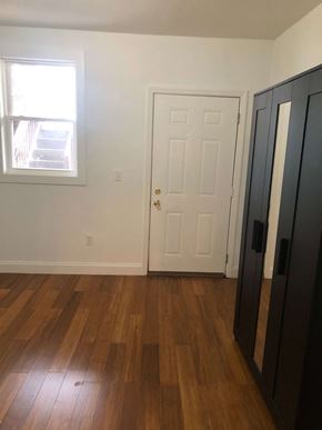 Jersey City apartment for rent - an empty room with a door and a window