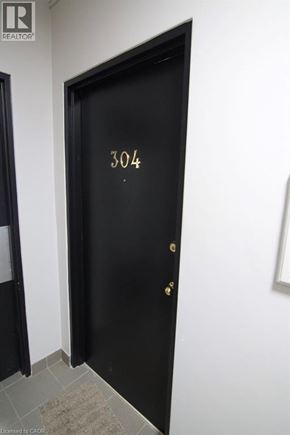 Kitchener apartment for rent - A black door with the number 304 on it.