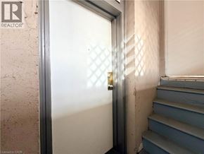 Hamilton apartment for rent - A door with a diamond pattern on the glass is open.