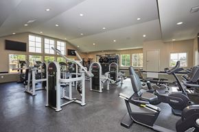 Chino Hills apartment for rent - a gym with cardio equipment and windows in a building