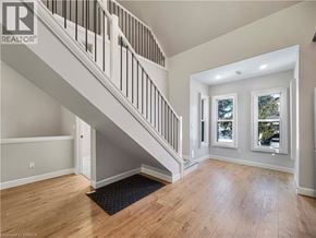 Woodstock house for rent - A spacious room with a staircase leading to the upper level.