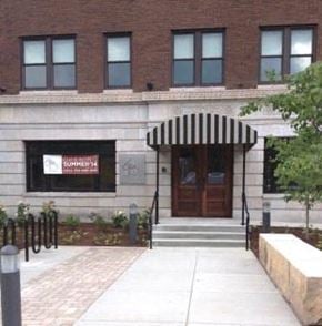 St. Louis apartment for rent - A building with a black and white striped awning.