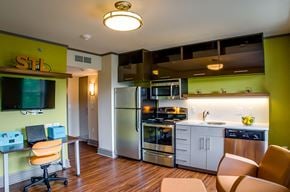 St. Louis apartment for rent - A kitchen with a green wall and stainless steel appliances.