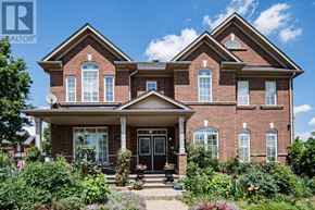 Burlington (Orchard) house for rent - A large brick house with a front porch and multiple windows.