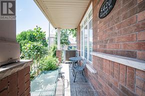 Burlington (Orchard) house for rent - A balcony with a table and chairs overlooks a garden.