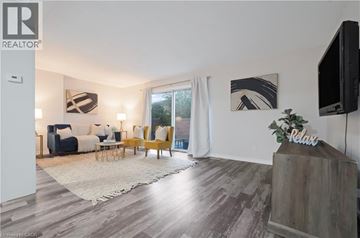 London townhouse for rent - A living room with a sofa set and a television.