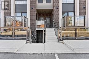 Niagara Falls (Arad/Fallsview) townhouse for rent - The front of a building with the sign RE/MAX Niagara Realty Ltd. Brokerage.