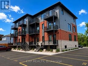 For rent in Russell - A building with a parking lot in front of it.