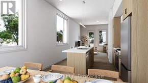 For rent in Russell - A modern kitchen with a dining table set with fruits and vegetables.
