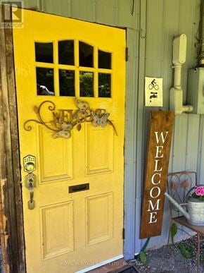 For rent in Tudor And Cashel (Tudor Ward) - A yellow door with a sign that says "welcome".