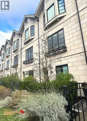 Vancouver townhouse for rent - A building with a sign that says "Hello" in front of it.
