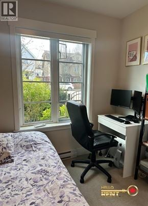 Vancouver townhouse for rent - A bedroom with a bed, desk, and chair.