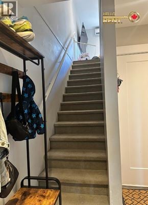 Vancouver townhouse for rent - A staircase with a coat rack on the side.
