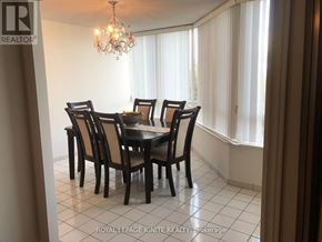 Toronto (Rouge) condo for rent - A dining room with a table set for six.