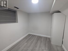 Niagara Falls (Dorchester) house for rent - A room with a grey floor and a window with blinds.
