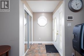 Grimsby (Grimsby Escarpment) house for rent - A hallway with a clock on the wall and a door on the right.