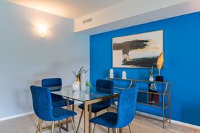 Beltsville apartment for rent - a dining room with blue walls and a table and chairs