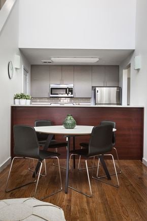 Orange apartment for rent - Table and chairs in front of kitchen and counter top