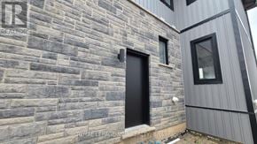 Niagara Falls (Brown) house for rent - A house with a black door and windows is shown.
