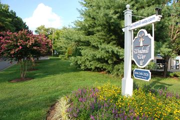 Mechanicsville apartment for rent - A sign for Windmill Way stands in a flower bed.