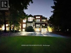 Toronto (Guildwood) house for rent - A large, well-lit house is shown at night with the text "ROMALLIEDA GOD AS REALTY, Brokerage" at the bottom.