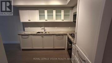 Toronto (Englemount-Lawrence) condo for rent - A living room with a fireplace and a chandelier.
