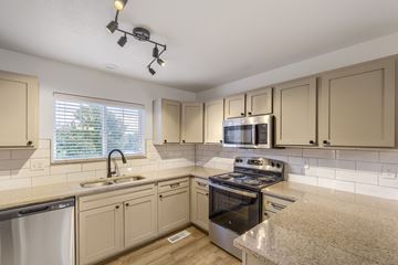 Castle Rock apartment for rent - A kitchen with a stove top oven and a sink.