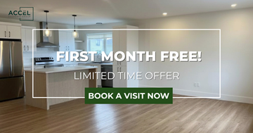 Moncton apartment for rent - A kitchen with a refrigerator, stove, and oven is on sale for the first month free.