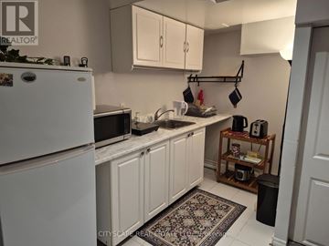 Mississauga (Churchill Meadows) house for rent - A kitchen with white cabinets and a white fridge.