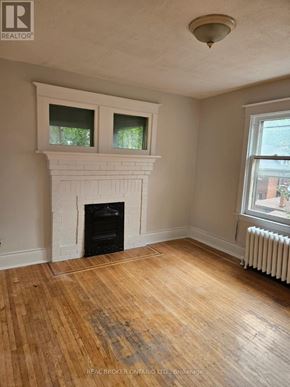 Hamilton (Crown Point) multi-family for rent - A room with a fireplace and wood flooring.