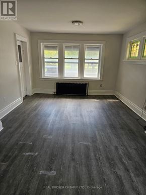 Hamilton (Crown Point) multi-family for rent - A room with wood flooring and a window.